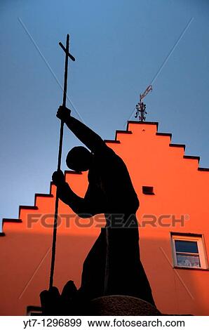 Silhouette of a religious statue at Fussen in the Romantic road, Bavaria, Germany View Large Photo Image Stock Photo - Silhouette of a religious statue at Fussen in the Romantic road, Bavaria, Germany. Fotosearch