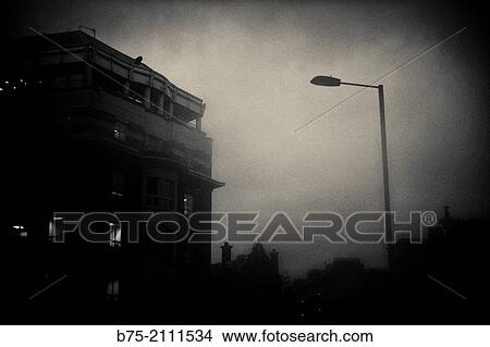 Silhouette of a residential building and lamppost in the street, Evening in London, England, UK, Europe View Large Photo Image Picture - Silhouette of a residential building and lamppost in the street, Evening in London, England, UK, Europe. Fotosearch