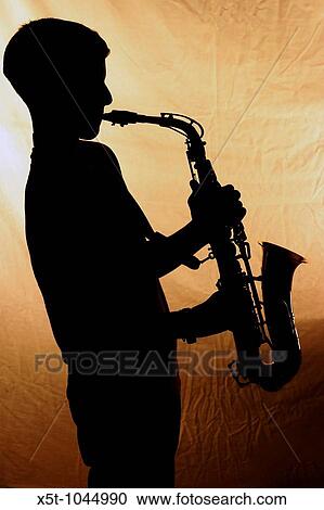 Silhouette of a Saxophone player - close up View Large Photo Image Stock Image - Silhouette of a Saxophone player - close up. Fotosearch