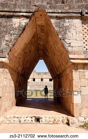 Silhouette of a tourist at a gateway in Uxmal ruins, Prehispanic Mayan city of Uxmal Archaeological Site, Yucatan Province, Mexico, North America. View Large Photo Image Stock Image - Silhouette of a tourist at a gateway in Uxmal ruins, Prehispanic Mayan city of Uxmal Archaeological Site, Yucatan Province, Mexico, North America.. Fotosearch