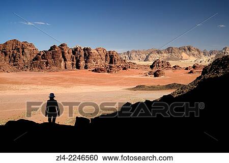 Silhouette of a woman and red sand desert from Jebel Qattar. Jordan, Wadi Rum desert, protected area inscribed on UNESCO World Heritage list. Model Released. View Large Photo Image Stock Image - Silhouette of a woman and red sand desert from Jebel Qattar. Jordan, Wadi Rum desert, protected area inscribed on UNESCO World Heritage list. Model Released.. Fotosearch