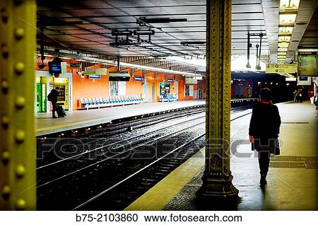 Silhouette of a woman walking on the platform of a subway station in Paris, France. View Large Photo Image Stock Image - Silhouette of a woman walking on the platform of a subway station in Paris, France.. Fotosearch