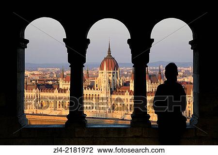 Silhouette of a woman watching the Hungarian Parliament Building from the Fisherman's Bastion at sunset. Hungary, Budapest. Model Released. View Large Photo Image Stock Image - Silhouette of a woman watching the Hungarian Parliament Building from the Fisherman's Bastion at sunset. Hungary, Budapest. Model Released.. Fotosearch