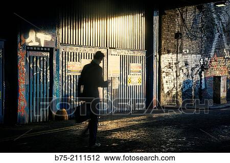 silhouette of an unrecognizable executive walking around East London. London, England, UK, Europe. View Large Photo Image Stock Image - silhouette of an unrecognizable executive walking around East London. London, England, UK, Europe.. Fotosearch