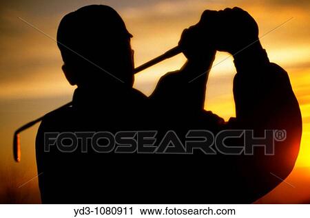 Silhouette of golfer swinging golf club at sunset View Large Photo Image Stock Image - Silhouette of golfer swinging golf club at sunset. Fotosearch