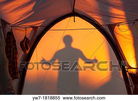 Silhouette of man gesturing ok reflected on a tent View Large Photo Image Stock Photography - Silhouette of man gesturing ok reflected on a tent. Fotosearch
