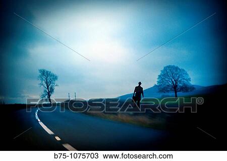 Silhouette of man on a road View Large Photo Image Stock Image - Silhouette of man on a road. Fotosearch