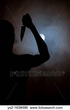 Silhouette of man with a knife looking at the moon View Large Photo Image Stock Photograph - Silhouette of man with a knife looking at the moon. Fotosearch