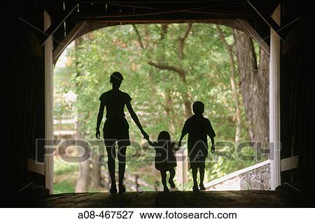 Silhouette of mom with two children in covered bridge. Pennsylvania, USA View Large Photo Image Stock Photo - Silhouette of mom with two children in covered bridge. Pennsylvania, USA. Fotosearch