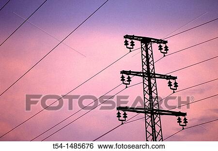 Silhouette of overland pipelines and an electricity pylon in the dusk View Large Photo Image Stock Photograph - Silhouette of overland pipelines and an electricity pylon in the dusk. Fotosearch