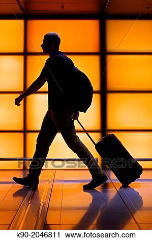 Silhouette of walking man with luggage, Hong Kong, China, East Asia. View Large Photo Image Stock Image - Silhouette of walking man with luggage, Hong Kong, China, East Asia.. Fotosearch