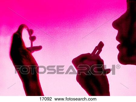 Silhouette of woman applying make-up View Large Photo Image Stock Image - Silhouette of woman applying make-up. Fotosearch