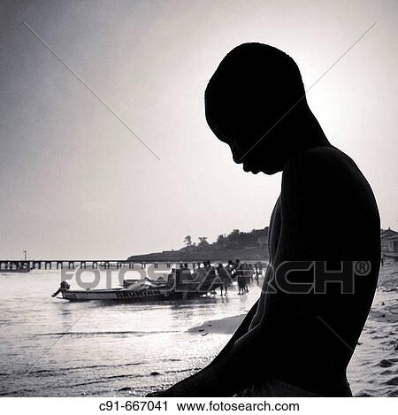 Silhouette of young fishermen and boat. Gambia View Large Photo Image Stock Image - Silhouette of young fishermen and boat. Gambia. Fotosearch