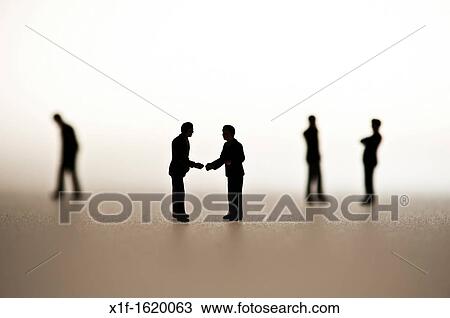 silhouetted small figures conceptual image for business men meeting View Large Photo Image Stock Image - silhouetted small figures conceptual image for business men meeting. Fotosearch
