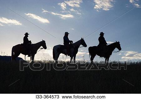 Silhouettes against dawn sky. Montana. USA View Large Photo Image Stock Image - Silhouettes against dawn sky. Montana. USA. Fotosearch