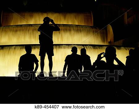 Silhouettes in front of fountain. Montjuic, Barcelona, Spain View Large Photo Image Stock Photo - Silhouettes in front of fountain. Montjuic, Barcelona, Spain. Fotosearch
