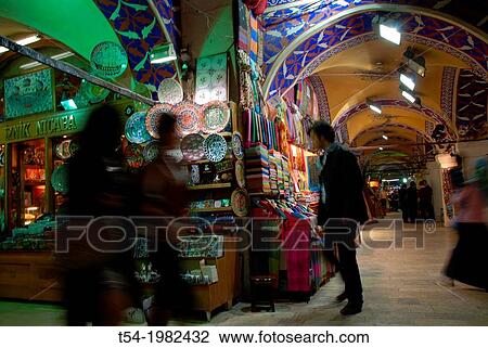 Stock Image - Silhouettes of people in the bazaar of Istanbul. Fotosearch