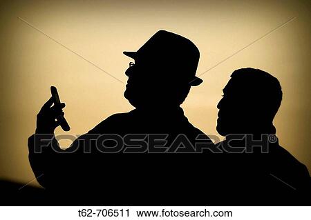 Silhouettes talking on the phone View Large Photo Image Stock Image - Silhouettes talking on the phone. Fotosearch
