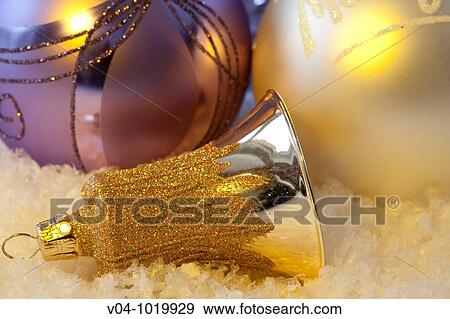 Silver bell and violett and white christmas baubles View Large Photo Image Stock Photo - Silver bell and violett and white christmas baubles. Fotosearch