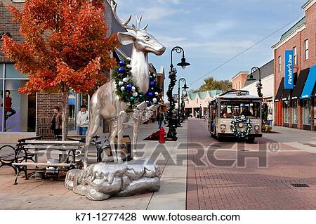 Stock Photo - Silver deer statues decorated for Christmas at the Branson Landing shopping center in Branson, Missouri, USA,. Fotosearch
