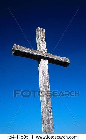 Simple wooden cross against a blue sky View Large Photo Image Stock Image - Simple wooden cross against a blue sky. Fotosearch