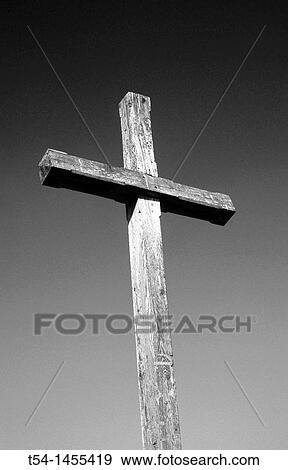 Simple wooden cross against a blue sky View Large Photo Image Stock Photo - Simple wooden cross against a blue sky. Fotosearch