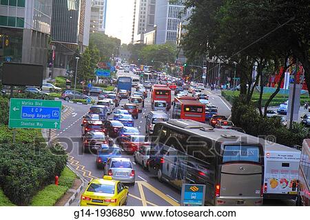 Stock Image - Singapore, Collyer Quay, traffic, cars, automobiles, buses, motor coaches, downtown,. Fotosearch