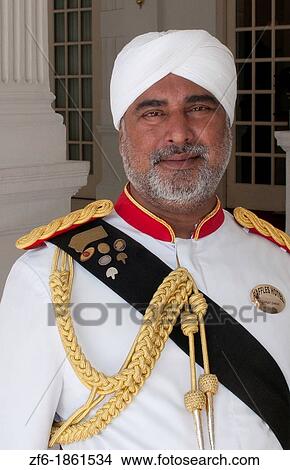 Singapore doorman at the exclusive world famous Raffles Hotel resort View Large Photo Image Picture - Singapore doorman at the exclusive world famous Raffles Hotel resort. Fotosearch
