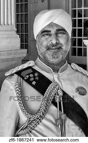 Singapore doorman at the exclusive world famous Raffles Hotel resort View Large Photo Image Stock Image - Singapore doorman at the exclusive world famous Raffles Hotel resort. Fotosearch