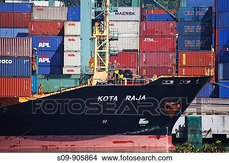 Singapore, Kampong Jagoh, Singapore Harbour, The Kota Raja merchant ship and containers View Large Photo Image Picture - Singapore, Kampong Jagoh, Singapore Harbour, The Kota Raja merchant ship and containers. Fotosearch