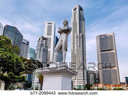 Stock Image - Singapore, Raffles staue against the modern highrise of the financial district.. Fotosearch