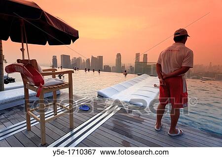 Singapore, swimmingpool and Singapore Skyline on the 57th floor of Marina Bay Sands Resort View Large Photo Image Stock Photo - Singapore, swimmingpool and Singapore Skyline on the 57th floor of Marina Bay Sands Resort. Fotosearch