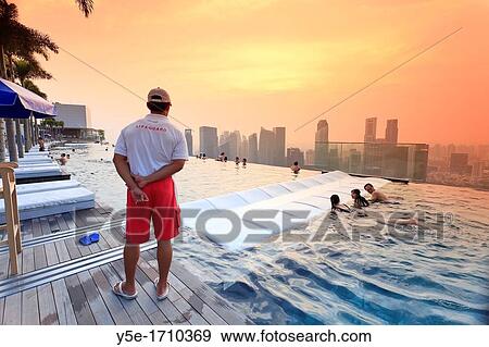 Singapore, swimmingpool and Singapore Skyline on the 57th floor of Marina Bay Sands Resort View Large Photo Image Stock Photo - Singapore, swimmingpool and Singapore Skyline on the 57th floor of Marina Bay Sands Resort. Fotosearch