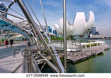 Singapore, view of Marina Bay and the Art Sience Museum from Helix Bridge. View Large Photo Image Stock Photo - Singapore, view of Marina Bay and the Art Sience Museum from Helix Bridge.. Fotosearch