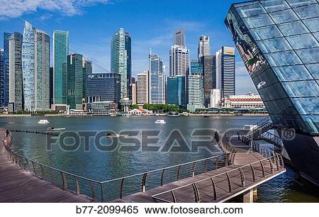 Singapore, view of the financial district from Marina Bay Sands waterfront boardwalk with Crystal Pavilion North. View Large Photo Image Stock Photography - Singapore, view of the financial district from Marina Bay Sands waterfront boardwalk with Crystal Pavilion North.. Fotosearch