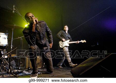 Singer on knees and bass player, Leamington, Canada. The band is Firelife, an up and coming Christian rock band. View Large Photo Image Stock Image - Singer on knees and bass player, Leamington, Canada. The band is Firelife, an up and coming Christian rock band.. Fotosearch