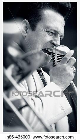 Singer with vintage microphone, swing band View Large Photo Image Stock Image - Singer with vintage microphone, swing band. Fotosearch