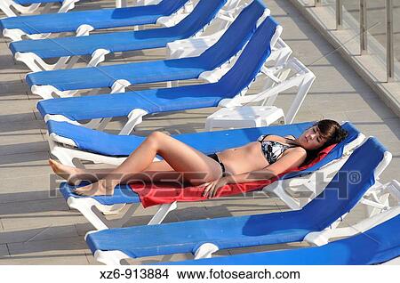 single girl in a sunbathing terrace View Large Photo Image Picture - single girl in a sunbathing terrace. Fotosearch