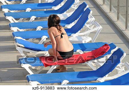 single girl sitting in the chair on a terrace View Large Photo Image Stock Image - single girl sitting in the chair on a terrace. Fotosearch
