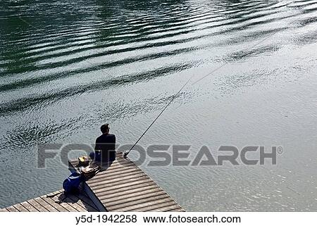 single man fishing with a rod, Rhone river, Geneva, Switzerland View Large Photo Image Stock Photo - single man fishing with a rod, Rhone river, Geneva, Switzerland. Fotosearch