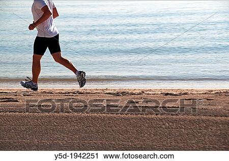 single man jogging on the beach, Playa Muro, Mallorca, Balearic Islands, Spain, Europe View Large Photo Image Stock Image - single man jogging on the beach, Playa Muro, Mallorca, Balearic Islands, Spain, Europe. Fotosearch