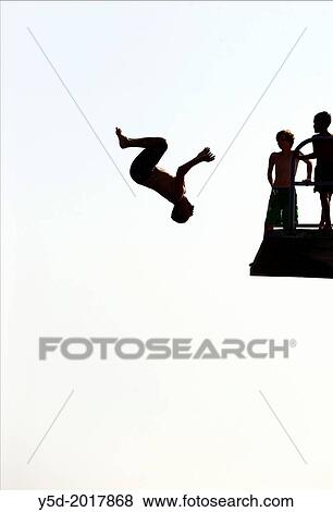 single man jumping from diving tower to waters of Lake Geneva, head first, Paquis beach, Geneva, Switzerland View Large Photo Image Stock Photo - single man jumping from diving tower to waters of Lake Geneva, head first, Paquis beach, Geneva, Switzerland. Fotosearch