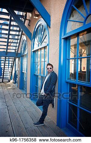single man leaning on window arched wall View Large Photo Image Stock Photo - single man leaning on window arched wall. Fotosearch