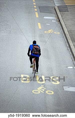single man on the bicycle, street marked for bus and bicycle, bicycle and buses path, Geneva, Switzerland View Large Photo Image Stock Image - single man on the bicycle, street marked for bus and bicycle, bicycle and buses path, Geneva, Switzerland. Fotosearch