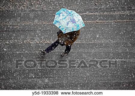 single person under umbrella crossing street in heavy snowfall, Geneva, Switzerland View Large Photo Image Stock Photo - single person under umbrella crossing street in heavy snowfall, Geneva, Switzerland. Fotosearch