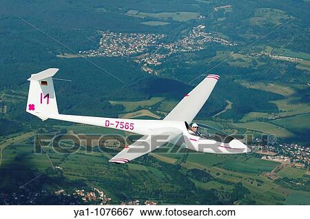 Single seat glider Asw 19b in flight over french Lorraine countryside - France View Large Photo Image Stock Photo - Single seat glider Asw 19b in flight over french Lorraine countryside - France. Fotosearch