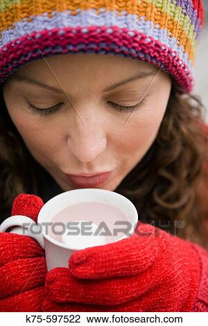 Stock Image - Sipping hot chocolate. Fotosearch