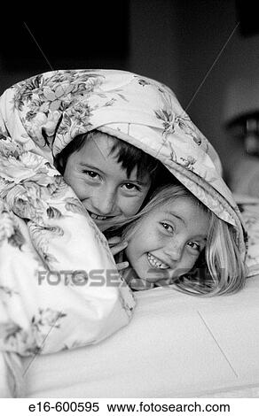 Sister and brother under covers together View Large Photo Image Stock Photography - Sister and brother under covers together. Fotosearch