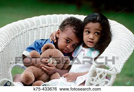 Sister hugging younger brother View Large Photo Image Stock Photograph - Sister hugging younger brother. Fotosearch