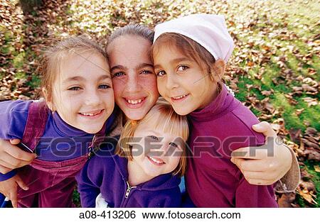 Sisters of varied ages hug and mug for camera. USA. View Large Photo Image Stock Photograph - Sisters of varied ages hug and mug for camera. USA.. Fotosearch